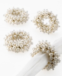 Cuff napkins in Tiffany rings for a fun, feminine touch. Faux pearls capped with sparkling glass beads band together in an explosion of whimsy. Cuff napkins in Tiffany rings for a fun, feminine touch. Faux pearls capped with sparkling glass beads band together in an explosion of whimsy.