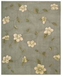 Floral appeal. Gracefully designed with delicate blossoms against a grey-blue ground, this area rug is hand tufted and hand carved from only the finest premium wool, then expertly washed to lend the surface a handsome luster, texture and sheen. Floral appeal. Gracefully designed with delicate blossoms against a grey-blue ground, this area rug is hand tufted and hand carved from only the finest premium wool, then expertly washed to lend the surface a handsome luster, texture and sheen.