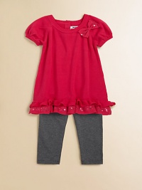 Sweet bows, sequins and ruffles adorn this adorable sweater tunic and leggings set.  Tunic Ribbed roundneckShort puff sleevesBow and sequin accentsRuffled hemBack keyhole with button closure Leggings Elastic waistbandPull-on styleTunic: cotton/acrylicLeggings: cotton/spandexMachine washImported