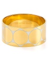 kate spade new york lends every outfit a golden touch with this simply styled bangle, engraved with a royally chic saying.