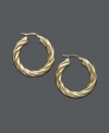 An instant classic. These twist hoop earrings will quickly become a staple in your wardrobe. Crafted in 14k gold over sterling silver. Approximate diameter: 1 inch.