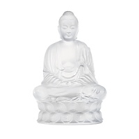 A meditating buddha figure makes a serene focal point displayed in any room. This sculptural object from Lalique is formed by hand of weighty crystal.