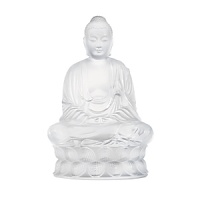 A meditating buddha figure makes a serene focal point displayed in any room. This sculptural object from Lalique is formed by hand of weighty crystal. A meditating buddha figure makes a serene focal point displayed in any room. This sculptural object from Lalique is formed by hand of weighty crystal.