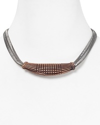 An instant wow piece. This Giles & Brother necklace flaunts serpentine allure with sinuous chains, cast in antique-finished rose gold and hematite. An instant wow piece. This Giles & Brother necklace flaunts serpentine allure with sinuous chains, cast in antique-finished rose gold and hematite.