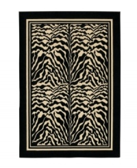 Bring the exotic landscape of the African Serengeti to you living space with this eye-catching zebra print rug. Four panels of black and white zebra stripes stand is stark contrast to each other, framed by a black border. The thick power-loomed pile presents a soft, luxurious finish and heaviness virtually indistinguishable from the work of master artisans. Made with meticulous detail of ultra-fine fiber that resists wear and permanent stains. One-year limited warranty. Bring the exotic landscape of the African Serengeti to you living space with this eye-catching zebra print rug. Four panels of black and white zebra stripes stand is stark contrast to each other, framed by a black border. The thick power-loomed pile presents a soft, luxurious finish and heaviness virtually indistinguishable from the work of master artisans. Made with meticulous detail of ultra-fine fiber that resists wear and permanent stains. One-year limited warranty.