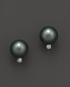 A timeless classic, these Tara Pearls earrings pair a black Tahitian pearl with a sparkling diamond accent.