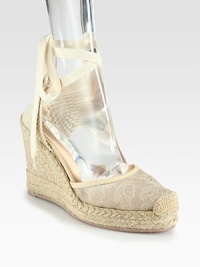 Semi-sheer floral lace and wrap-around ties add feminine style to this woven design, lifted by a textured espadrille wedge. Covered wedge, 4 (100mm)Covered platform, 1 (25mm)Compares to a 3 heel (75mm)Lace and woven fabric upper with leather trimLeather liningRubber trek solePadded insoleMade in Italy