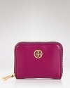 An understated logo medallion details this leather Tory Burch coin case, which features a key ring and two compartments for the small scale essentials.