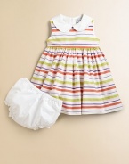 Fresh, fun stripes on crisp cotton in a charming frock for your little fashionista.Contrast Peter Pan collarSleevelessEmpire waist with grosgrain ribbon waistband back tiesBack buttonsFull skirtSolid bloomers with elasticized waist and leg openingsCotton liningCottonMachine washImported Please note: Number of buttons may vary depending on size ordered. 