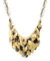 Cascading leaves in two-tone metallics look good whatever the season! Kenneth Cole New York's shimmery cluster necklace features leaf-shaped charms in gold and hematite-plated mixed metal. Approximate length: 17 inches +3-inch extender. Approximate drop: 2 inches.