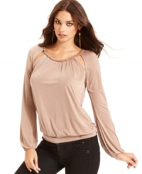 Chain hardware and cutouts add a glam appeal to this GUESS top -- perfectly paired with skinny jeans for a hot soiree look! Chain hardware and cutouts add a glam appeal to this GUESS top -- perfectly paired with skinny jeans for a hot soiree look!