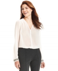 A floaty, semi-sheer top is dressed up with chunky beaded cuffs for a look both high in contrast and style. From Ellen Tracy. (Clearance) A floaty, semi-sheer top is dressed up with chunky beaded cuffs for a look both high in contrast and style. From Ellen Tracy. (Clearance)