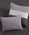 Bold and modern, this Calvin Klein decorative pillow features tonal bands in stylish plum tones. Pillow comes stuffed and features an envelope closure.