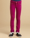 Super skinny, almost like leggings, these clingy jeans have street-smart golden studs edging the pockets for a touch of bling.Waistband with button close and belt loopsZip flyFront scoop pockets with studs and coing pocket with charmBack patch pockets with studsSkinny fit86% cotton/11% polyester/3% spandexMachine washMade in USA