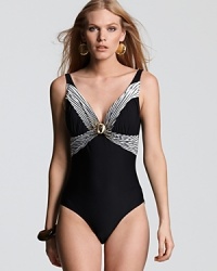 Gottex's v neck one piece boasts flattering cut and elegant detailing. With its notice me neckline, this suit brings a touch of glamour to your bathing look. Gottex's v neck one piece boasts flattering cut and elegant detailing. With its notice me neckline, this suit brings a touch of glamour to your bathing look.