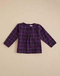 Burberry's elegant Kiara shirt features a clean silhouette, soft pleat accents at the chest and a full button back closure. Burberry's elegant Kiara shirt features a clean silhouette, soft pleat accents at the chest and a full button back closure.