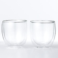 Handmade by expert artisans, this insulated, double-wall glassware is made from a lightweight borosilicate glass that is just as strong as typical glassware. Resistant to temperature swings and scratches, it keeps both warm drinks and cool drinks at just the right temperature. Because beverages are held entirely by the inner wall, there's no condensation-so no need for a coaster. Handmade by expert artisans, this insulated, double-wall glassware is made from a lightweight borosilicate glass that is just as strong as typical glassware. Resistant to temperature swings and scratches, it keeps both warm drinks and cool drinks at just the right temperature. Because beverages are held entirely by the inner wall, there's no condensation-so no need for a coaster.