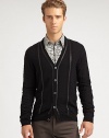 Cool-weather layering never looked so good, and adding this button-front cardigan is a sure-fire way to beat the chill in style; neatly woven in pure virgin wool with a sleek leather trim for a modern contrast.Button-frontRibbed knit cuffs and hemChest welt, hip flap pocketsRear ventAbout 37 from shoulder to hemPure virgin woolMachine washMade in Italy