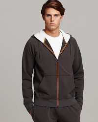 Full front zip hooded sweatshirt with split kangaroo pocket. Thermal, contrast lined hoodie. Orange trim detail at zipper. Full front zip hooded sweatshirt with split kangaroo pocket. Thermal, contrast lined hoodie. Orange trim detail at zipper.
