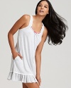 Sleep soundly in this comfortable striped chemise with ruffle trim and bow accents.