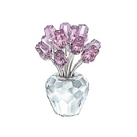The vase and the 12 rosebuds in faceted crystal; Clear crystal stones in the middle of each bud; Rosaline colored roses. Stems rhodium plated. The vase and the 12 rosebuds in faceted crystal; Clear crystal stones in the middle of each bud; Rosaline colored roses. Stems rhodium plated.