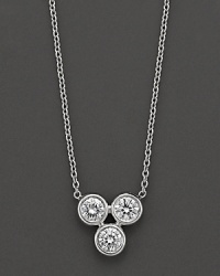 Crafted in 18 Kt. white gold with diamond accents, this pendant necklace is centered on a cluster of 3 gold beads. With Roberto Coin's signature ruby accents. Crafted in 18 Kt. white gold with diamond accents, this pendant necklace is centered on a cluster of 3 gold beads. With Roberto Coin's signature ruby accents.