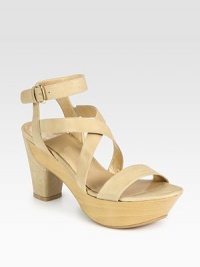 Supple leather straps elevated by a natural wooden platform, concluding with an adjustable ankle strap. Leather-covered wooden heel, 4 (100mm)Wooden platform, 1½ (40mm)Compares to a 2½ heel (65mm)Leather upperLeather liningRubber solePadded insoleImportedOUR FIT MODEL RECOMMENDS ordering true size. Supple leather straps elevated by a natural wooden platform, concluding with an adjustable ankle strap. Leather-covered wooden heel, 4 (100mm)Wooden platform, 1½ (40mm)Compares to a 2½ heel (65mm)Leather upperLeather liningRubber solePadded insoleImportedOUR FIT MODEL RECOMMENDS ordering true size.