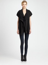 Hard-edged yet sophisticated, this cropped-back sweatshirt vest has an attached hood and short dolman sleeves. Attached hoodShort dolman sleevesFront snap closures; zipperCropped back hemPolyester/cottonDry cleanImportedModel shown is 5'11 (178cm) wearing US size X-Small/Small. Hard-edged yet sophisticated, this cropped-back sweatshirt vest has an attached hood and short dolman sleeves. Attached hoodShort dolman sleevesFront snap closures; zipperCropped back hemPolyester/cottonDry cleanImportedModel shown is 5'11 (178cm) wearing US size X-Small/Small.