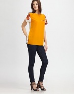 A vibrant pairing of lush florals and bold colorblock in an elegant crossover-back sheath.Jewel necklineButtons at shoulderShort sleevesChest pocketCrossover backAbout 24 from shoulder to hemPolyesterDry cleanImportedModel shown is 5'10 (178cm) wearing US size 4.