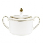 Rings of gold adorn fine white bone china with the lustrous shine of a wedding band. White bone china features two different border trims of gold, a wide corded border of textured grosgrain ribbon on some pieces, a narrow edge on others.