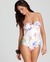 Gottex's floral-print one piece makes a painterly statement pooside. Artful yet elegant, this suit boasts gathered detailing that perfectly frames your curves.