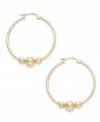 An elegant addition. Giani Bernini makes a stylish statement with its hoop earrings, featuring three beads to enhance the appeal. Set in 24k gold over sterling silver. Approximate diameter: 1-1/4 inches.