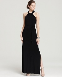 Brimming with elegance, this T Tahari maxi dress showcases a knotted halter neckline atop a dramatic silhouette. Two side slits amp up the wow factor. Brimming with elegance, this T Tahari maxi dress showcases a knotted halter neckline atop a dramatic silhouette. Two side slits amp up the wow factor.