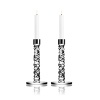 This brilliant pair of candleholders, designed by Lena Bergstrom, was crafted using new techniques that give the look of exquisitely cut diamonds.