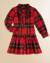 The essential shirt dress is rendered in a preppy plaid design with pretty ruffles.Club collarLong sleeves with roll-tab barrel cuffsButton-front with ruffled trimFlared hemCottonMachine washImported Please note: Number of buttons and snaps may vary depending on size ordered. 