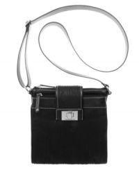 Finally, fashion and function combine. This crossbody bag by Tignanello features a built-in center wallet organizer and easy access pockets on both sides. Shiny hardware and a signature print perfectly finish this look. Finally, fashion and function combine. This crossbody bag by Tignanello features a built-in center wallet organizer and easy access pockets on both sides. Shiny hardware and a signature print perfectly finish this look.