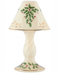 With bands of gold, pierced detail and a holly motif to match the beloved Holiday dinnerware pattern, this porcelain candle lamp from Lenox creates instant Christmas ambiance. With bands of gold, pierced detail and a holly motif to match the beloved Holiday dinnerware pattern, this porcelain candle lamp from Lenox creates instant Christmas ambiance.