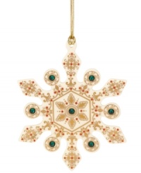 A traditional snowflake gets a makeover in this beautiful ornament from Lenox. Features an ornate gold design with emerald accents for a touch of glimmer. With gold hanging thread. A traditional snowflake gets a makeover in this beautiful ornament from Lenox. Features an ornate gold design with emerald accents for a touch of glimmer. With gold hanging thread.