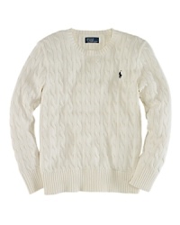 An essential crewneck sweater is rendered in cable-knit cotton for a timeless, preppy aesthetic. An essential crewneck sweater is rendered in cable-knit cotton for a timeless, preppy aesthetic.