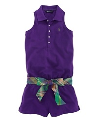 The classic polo shirt inspired a stylish racerback romper, rendered in stretch cotton mesh and finished with a preppy plaid self-belt. The classic polo shirt inspired a stylish racerback romper, rendered in stretch cotton mesh and finished with a preppy plaid self-belt.