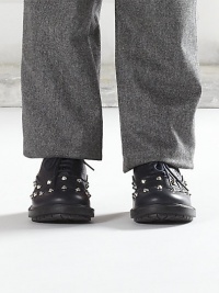 Leather lace-up shoes with cone-shaped studs, brogue detail and signature stripes.Lace-upLeather upperRubber solePadded insoleImported Leather lace-up shoes with cone-shaped studs, brogue detail and signature stripes.Lace-upLeather upperRubber solePadded insoleImported