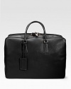 An elegant travel tote in saffiano leather with a full-zip closure and straps inside. Zip closure Top handles ID tag 20W X 14H X 7D Made in Italy 