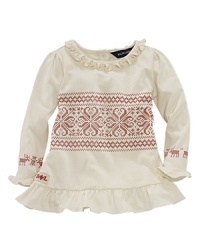 An adorable printed tunic with ruffle trim features a festive snowflake pattern. An adorable printed tunic with ruffle trim features a festive snowflake pattern.