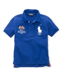A preppy short-sleeved polo shirt in breathable cotton mesh is accented with country embroidery, celebrating Team USA's participation in the 2012 Olympics. A preppy short-sleeved polo shirt in breathable cotton mesh is accented with country embroidery, celebrating Team USA's participation in the 2012 Olympics.