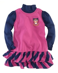 An adorable cotton jersey set layers a precious tiered ruffle jumper with a crest insignia over a cozy mockneck for a pulled-together, casual look. An adorable cotton jersey set layers a precious tiered ruffle jumper with a crest insignia over a cozy mockneck for a pulled-together, casual look.