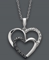 Double up on love. This sparkling heart-shaped style combines round-cut black diamonds (1/10 ct. t.w.) and white diamond accents in a polished sterling silver setting. Approximate length: 18 inches. Approximate drop: 1 inch.