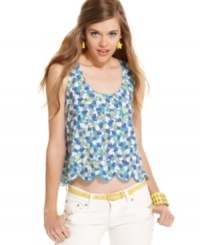 Slip into cute, summery design with this floral print top from Material Girl! Features a scalloped hem and fun cutout style at the back! Slip into cute, summery design with this floral print top from Material Girl! Features a scalloped hem and fun cutout style at the back!