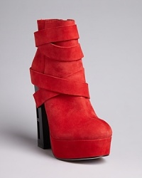 Soft suede straps wrap around the ankle and through the heel of Dolce Vita's platform Jyll booties. Soft suede straps wrap around the ankle and through the heel of Dolce Vita's platform Jyll booties.