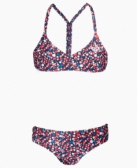 Flower power. The fun flower print decorating this two-piece swimsuit from Roxy is perfect for hitting the surf or relaxing on the sand. Flower power. The fun flower print decorating this two-piece swimsuit from Roxy is perfect for hitting the surf or relaxing on the sand.