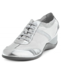 Casually chic. DKNY Active's Piri wedge sneakers will finish your look with some shine--and a little bit of height. Casually chic. DKNY Active's Piri wedge sneakers will finish your look with some shine--and a little bit of height.